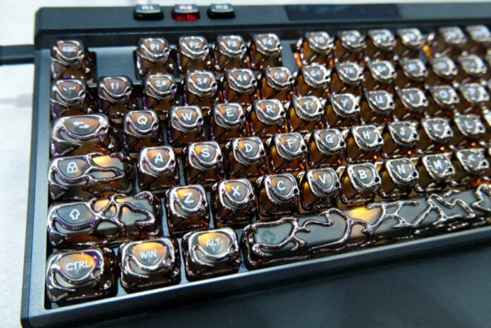MSI STRIKE Pro Wireless Special Edition keycaps with orange lighting.