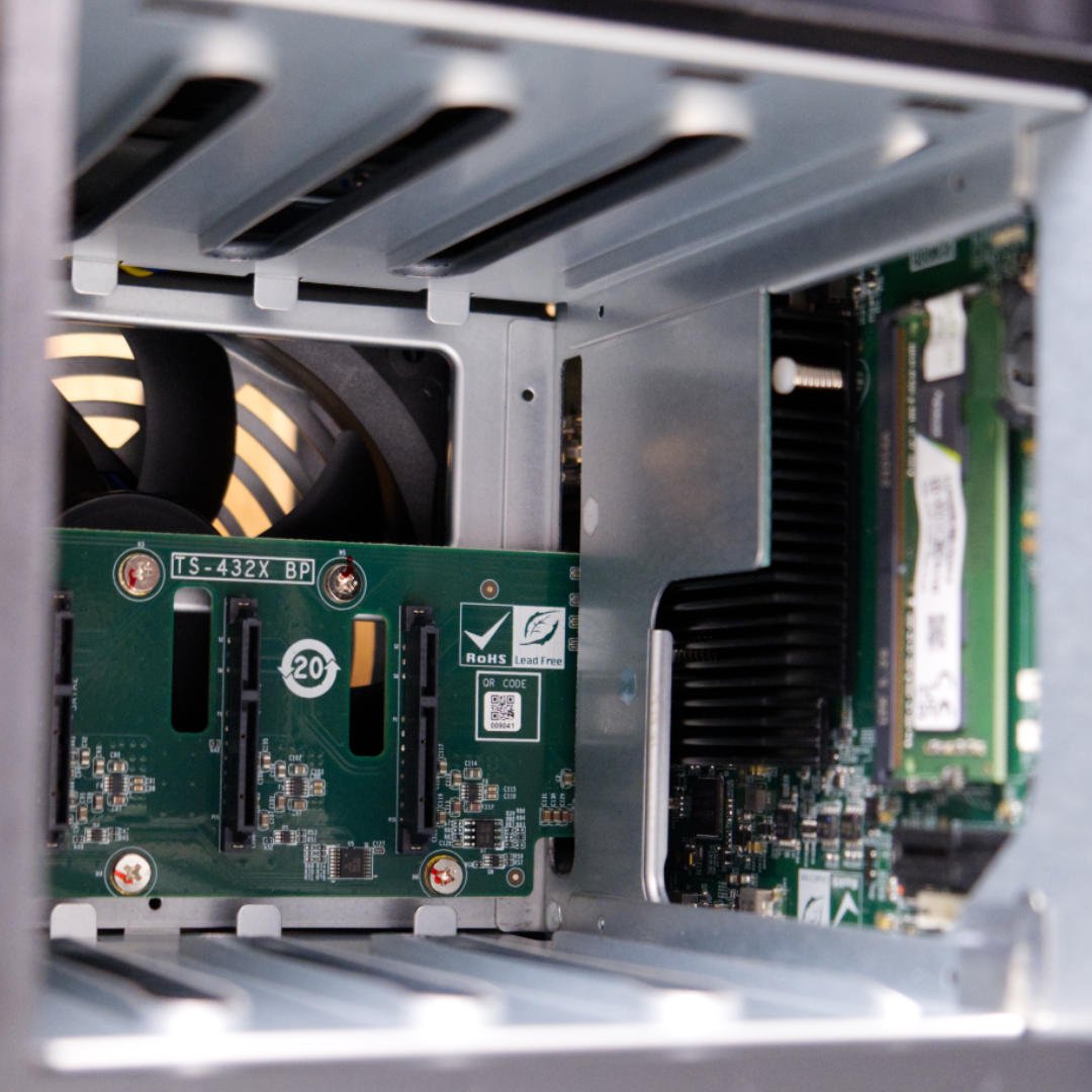 QNAP TS-432X innards with hard drive trays removed.