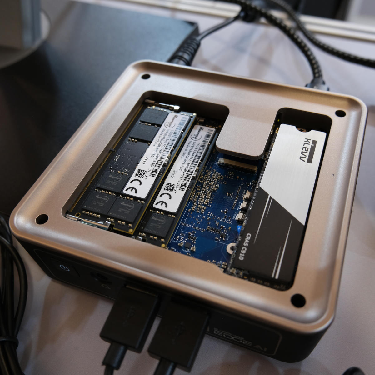 Top-down view of Sapphire Edge AI PC, with its top plate removed, revealing its RAM and NVMe SSD.