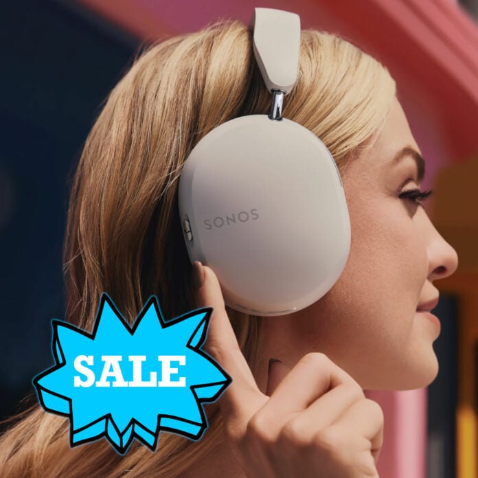 A blonde female-presenting person, wearing a pair of Sonos Ace in white, with a blue 'Sale' sticker appearing below their ear.