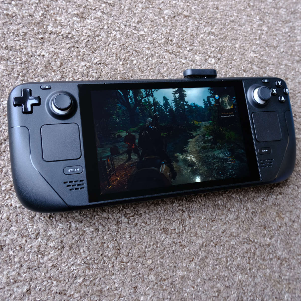 SteelSeries Arctis GameBuds 2.4GHz dongle plugged into a Steam Deck.