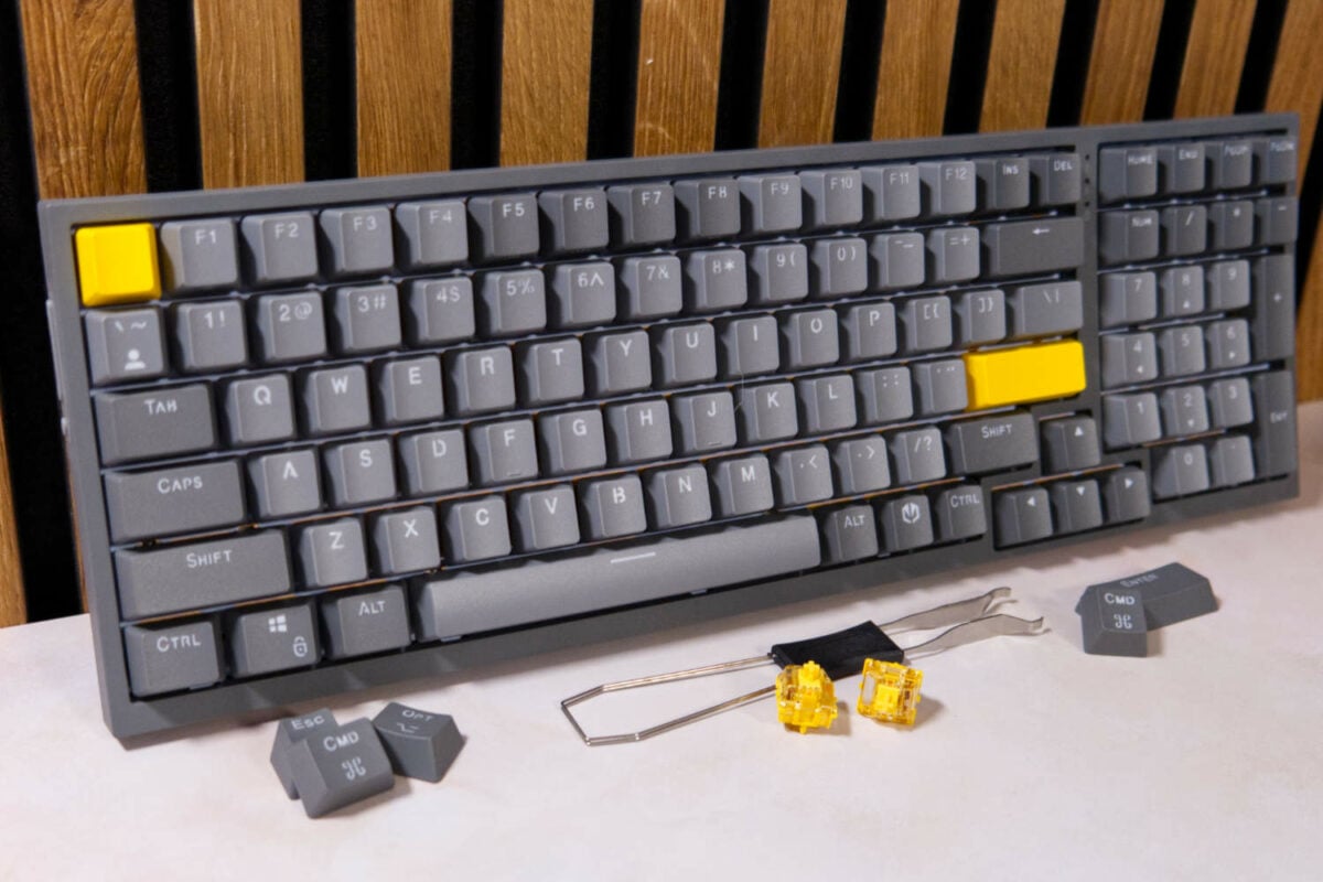 Endorfy Celeris 1800 gaming keyboard with its extra keycaps, switches, and tools.