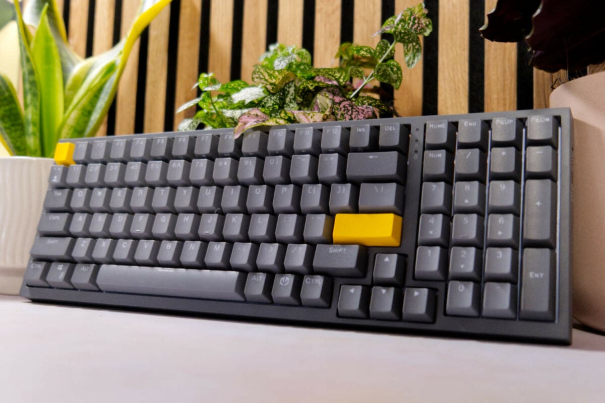 Endorfy Celeris 1800 gaming keyboard resting against plants.
