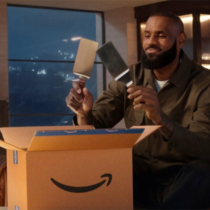 A man unboxes something from Amazon.