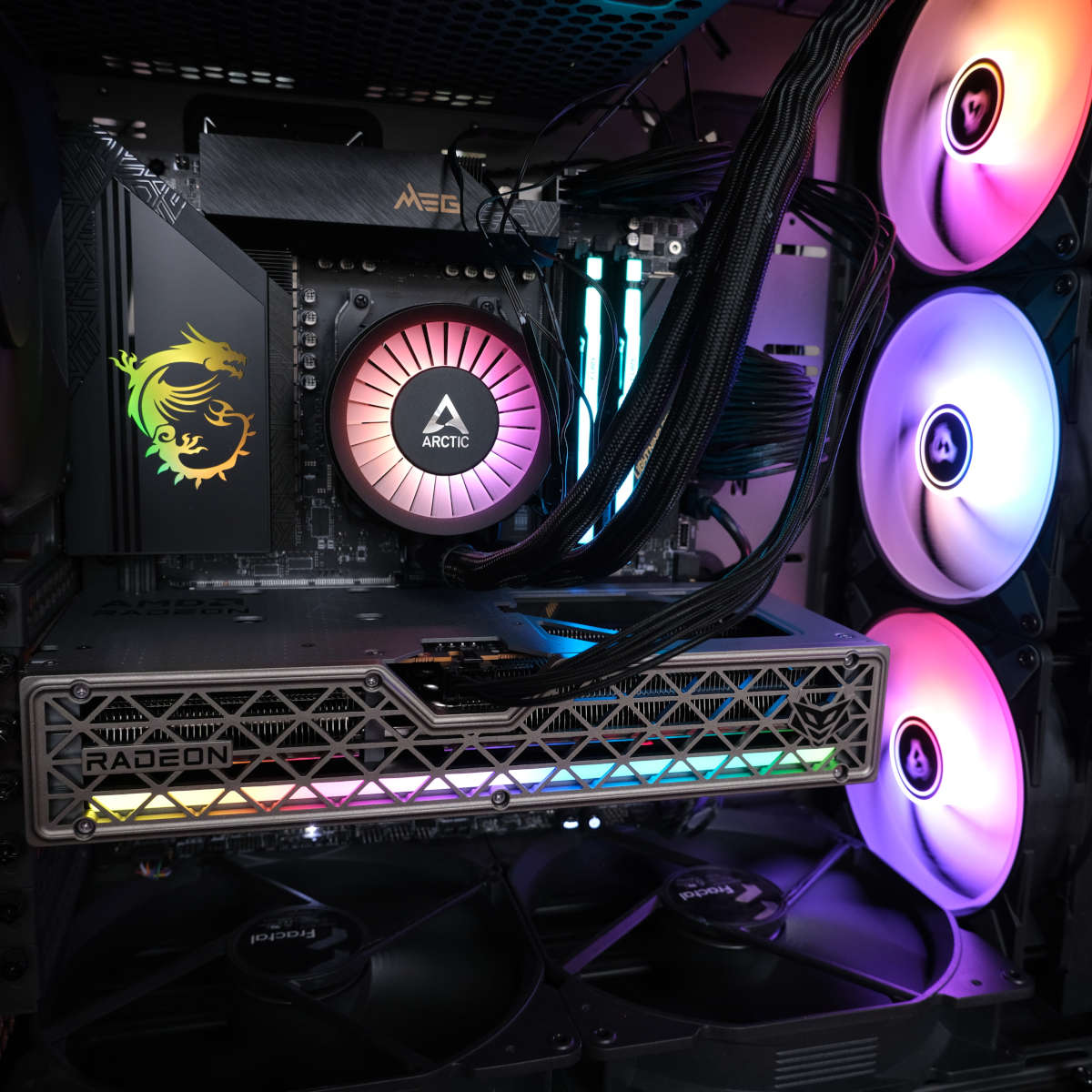 Wide shot of Sapphire Nitro+ Radeon RX 9060 XT 16GB powered on in side the Club386 test system, its ARB light bar glowing various colours.