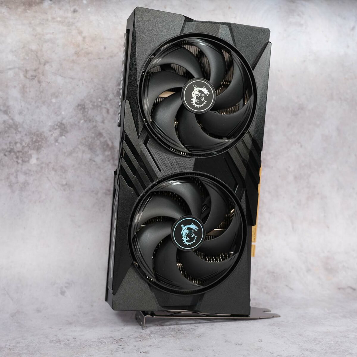 MSI GeForce RTX 5060 Gaming OC standing vertically against a pearlescent backdrop.