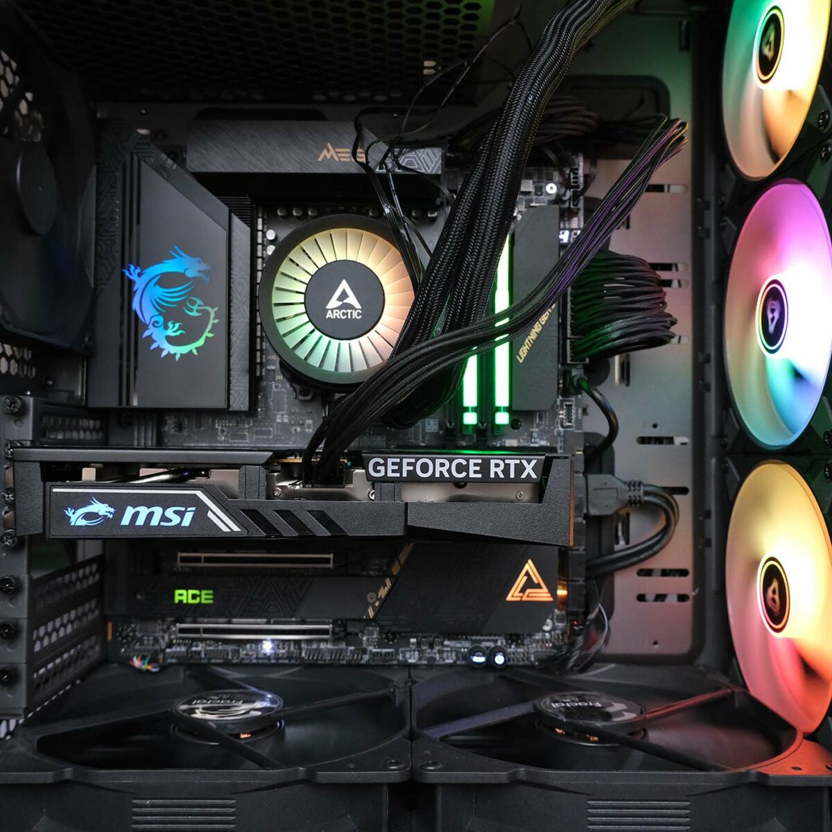 MSI GeForce RTX 5060 Gaming OC sits in the Club386 test system, surrounded by RGB LEDs from the motherboard, RAM, cooler, and fans.