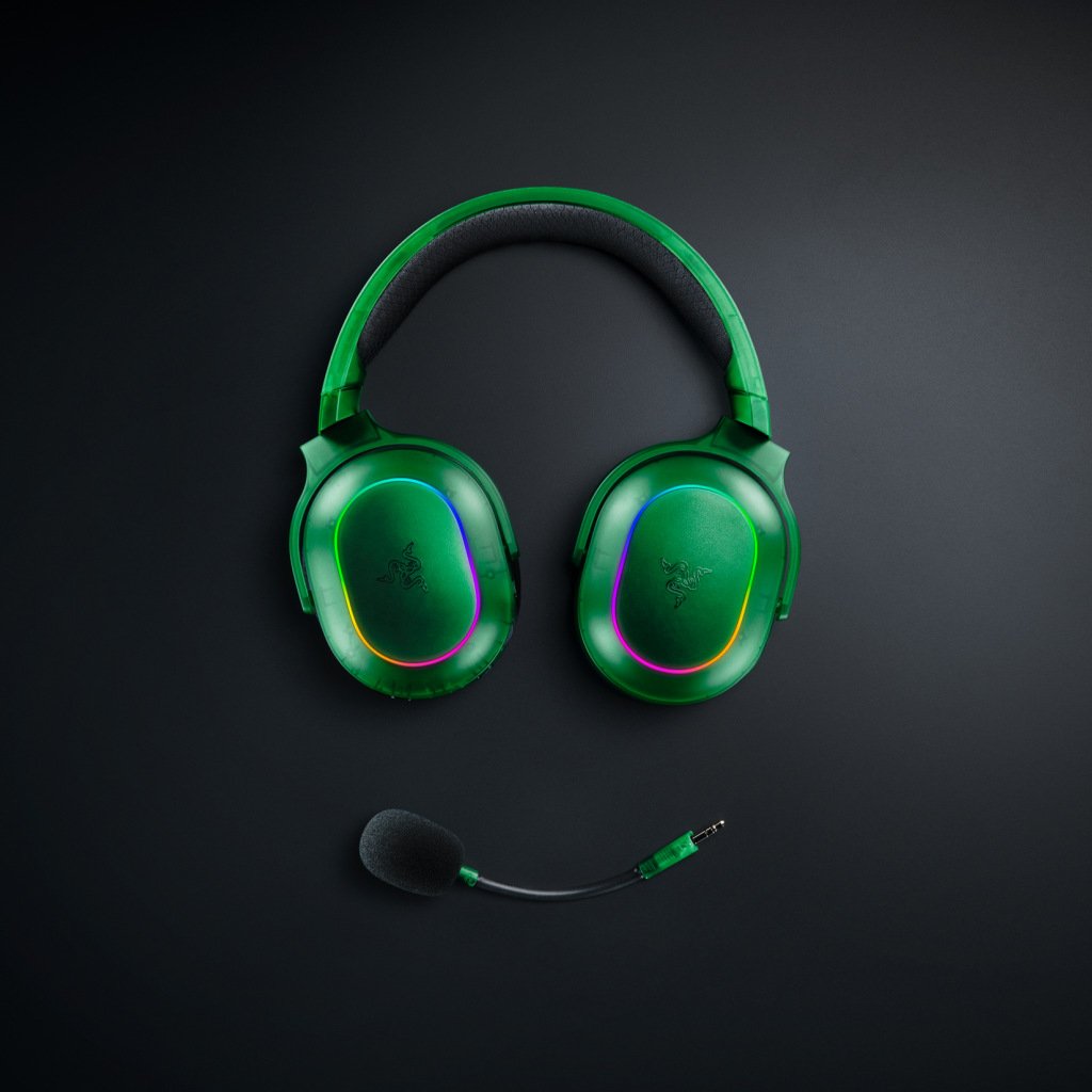 Razer Barracuda X Chroma – Phantom Green Edition, with its RGB LEDs on and resting above its detachable microphone.