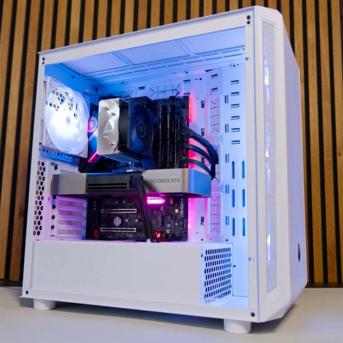 Endorfy Arx 700 White ARGB PC case glowing with colourful lighting.