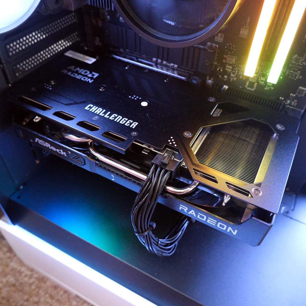 A close-up of the ASRock Radeon RX 9060 XT 16GB Challenger OC graphics card inside CyberPowerPC Ultra R87 Pro.