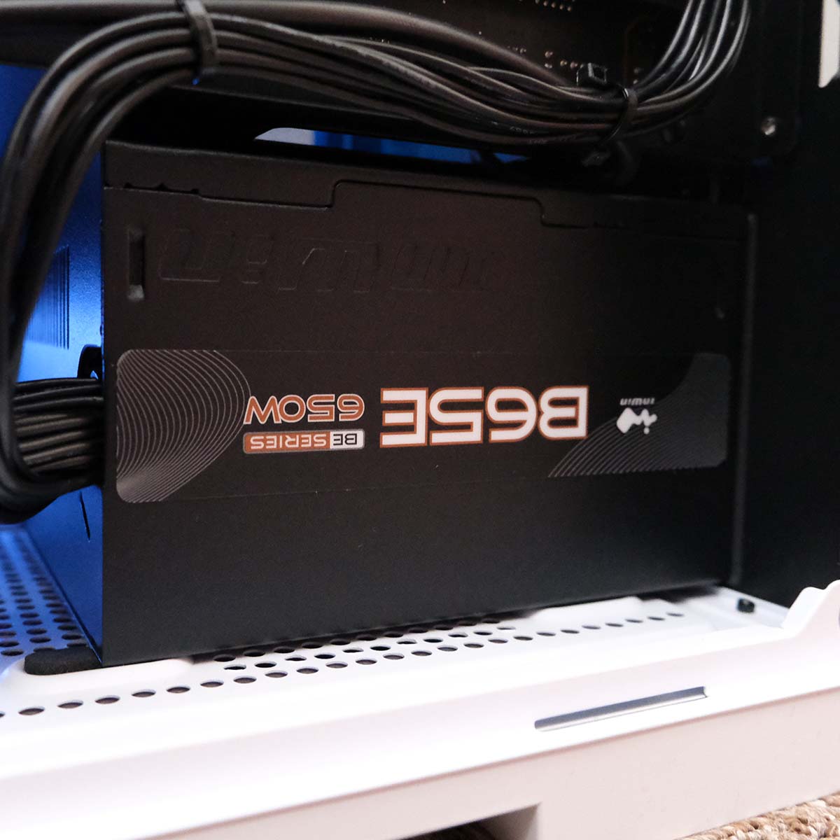 A close-up of the InWin B65E power supply inside CyberPowerPC Ultra R87 Pro.