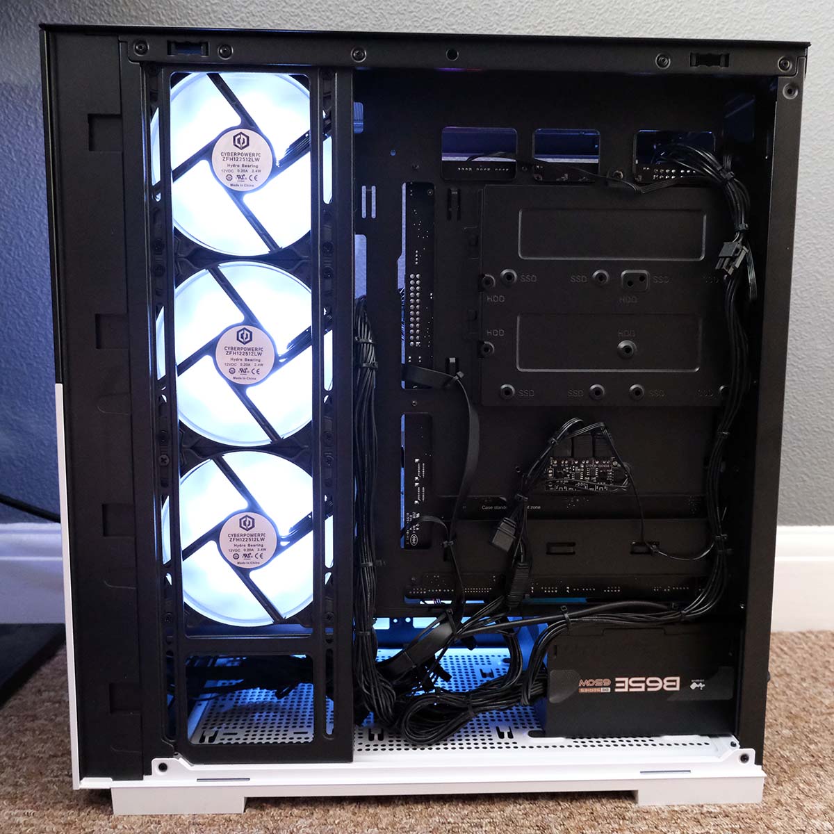 A wide shot of CyberPowerPC Ultra R87 Pro with an exposed back panel.