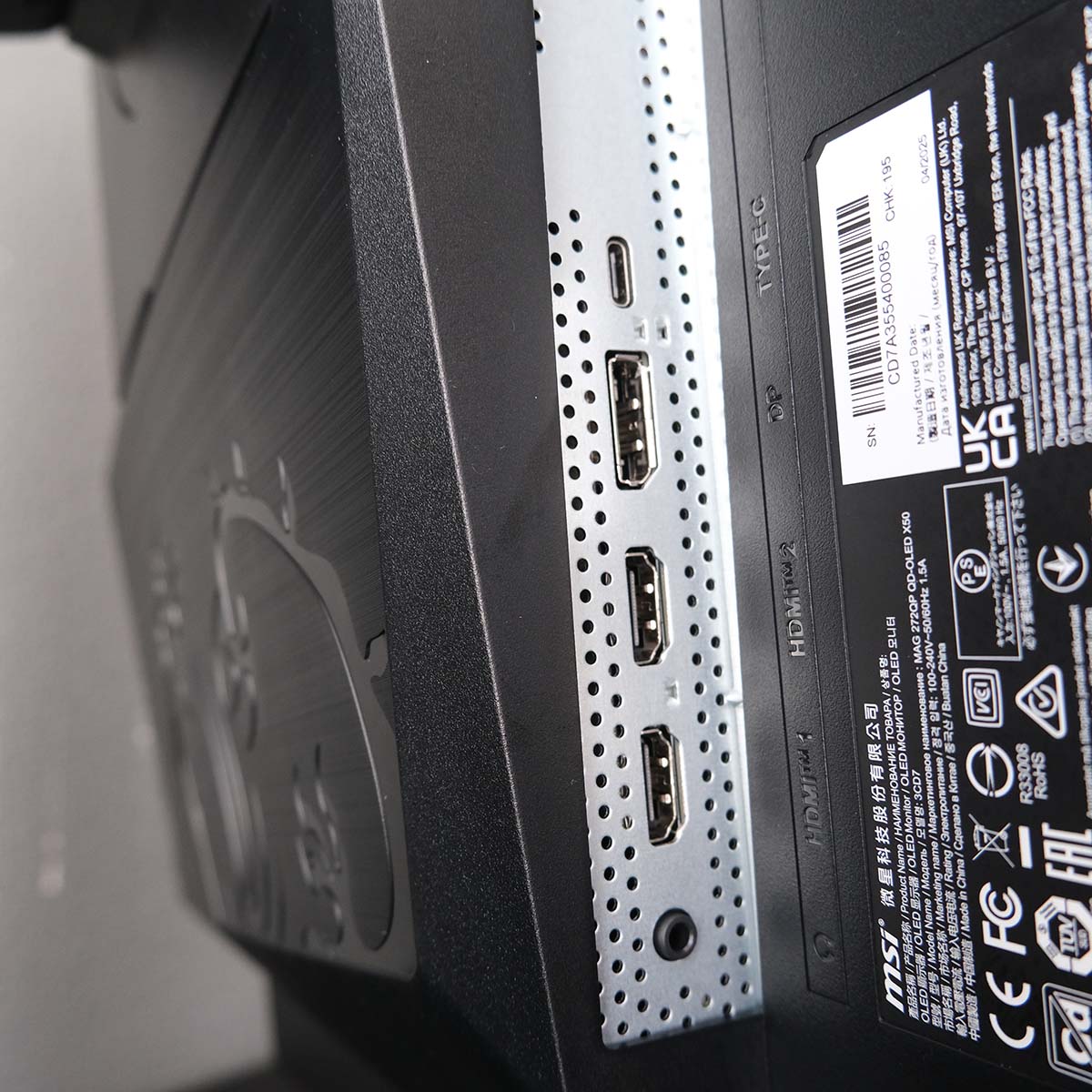 A close up of MSI MAG 272QP QD-OLED X50's ports, showcasing an array of HDMI 2.1, DisplayPort 1.4, and USB-C headers.