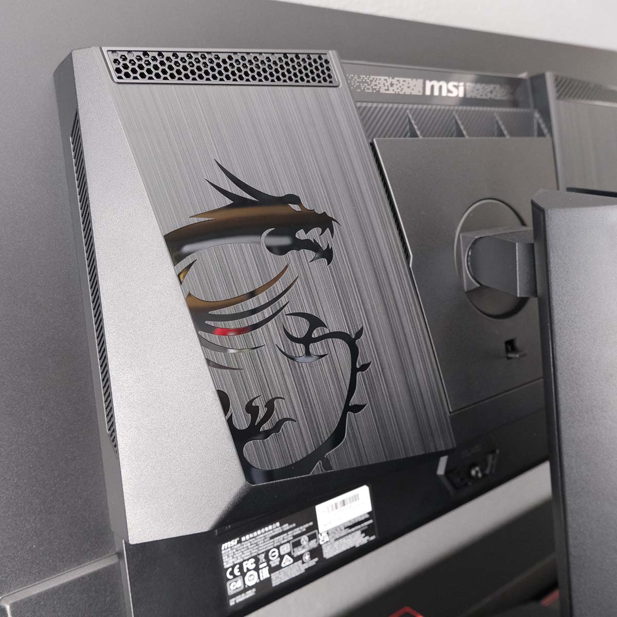 Close up of the dragon logo on the rear of MSI MAG 272QP QD-OLED X50.