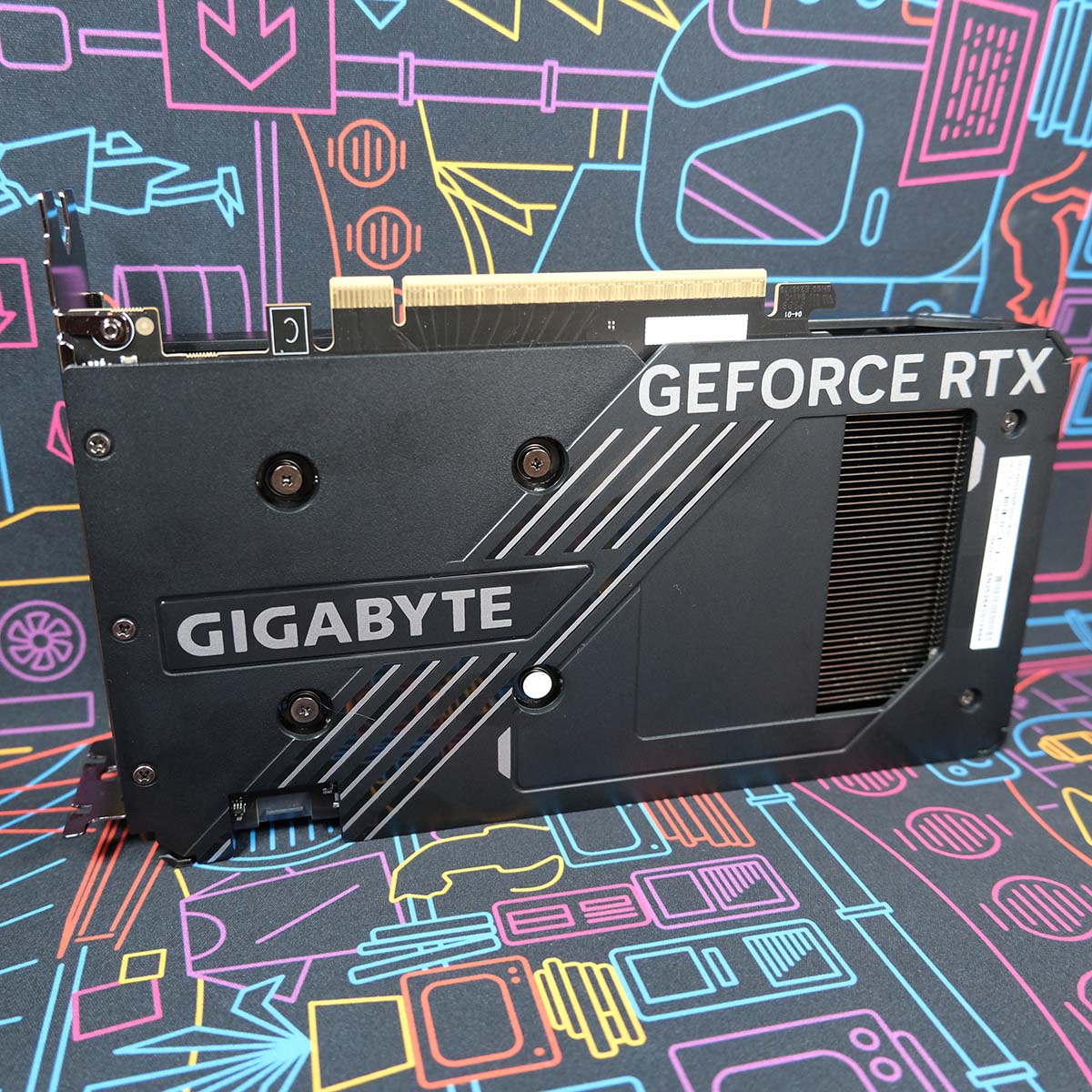 Gigabyte GeForce RTX 5050 Windforce OC graphics card sits upright, its backplate facing the camera.