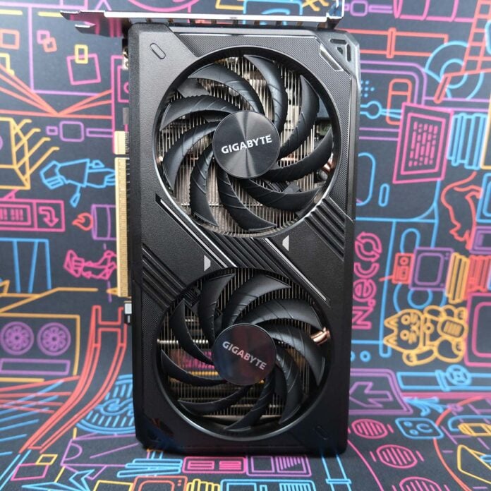 Gigabyte GeForce RTX 5050 Windforce OC graphics card stands upright, vertically, its frontplate facing the camera.