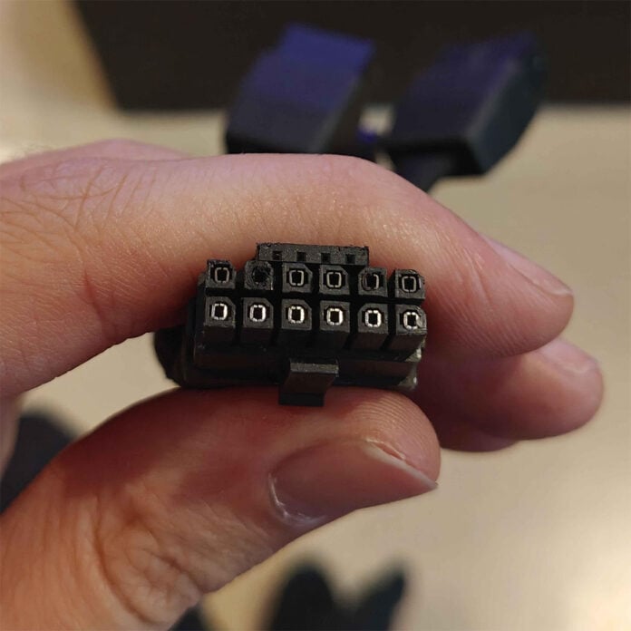 12V-2x6 power connector, featuring discolouration on several pins.