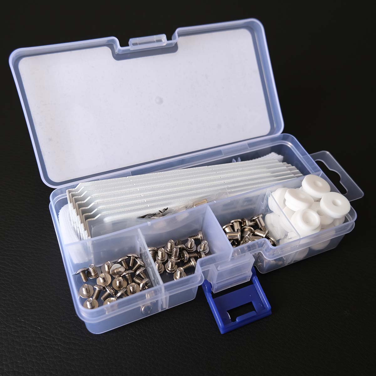Accessories box for Arctic Xtender VG, lid open, revealing screws and more.