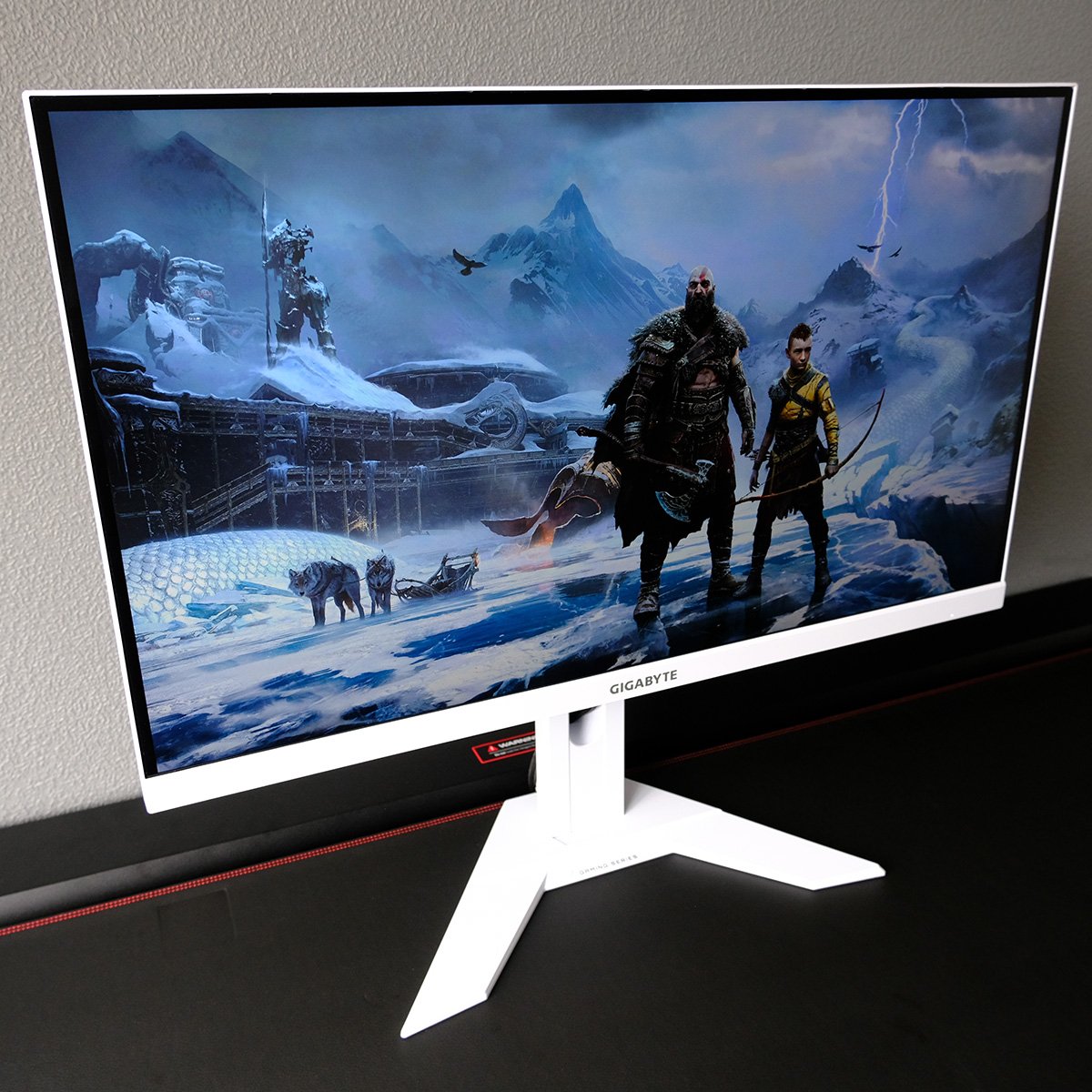 Gigabyte M27QA Ice gaming monitor, displaying God of War Ragnarök key art.