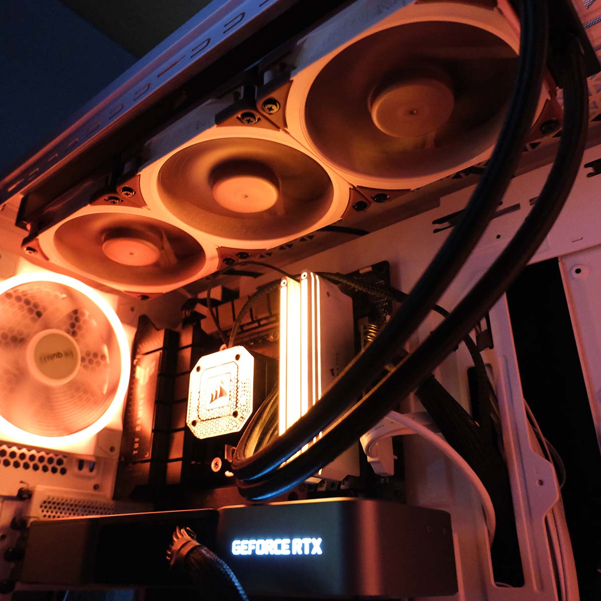 The inside of the test system used for Noctua NF-A12x25 G2, components glowing orange.