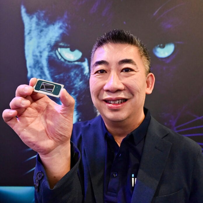 At Computex in Taipei, Taiwan, on Tuesday, May 20, 2025, Khoi Nguyen, software technical marketing engineer at Intel, displays a Panther Lake central processing unit. Panther Lake is Intel’s lead client computing processor built on the Intel 18A process node. It is expected to arrive in the second half of 2025 and scale in 2026.