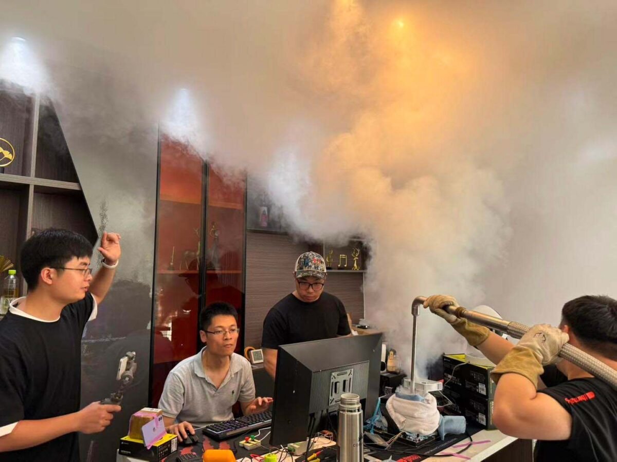 wytiwx and team, applying liquid nitrogen to Core i9-14900KF during their overclocking process.