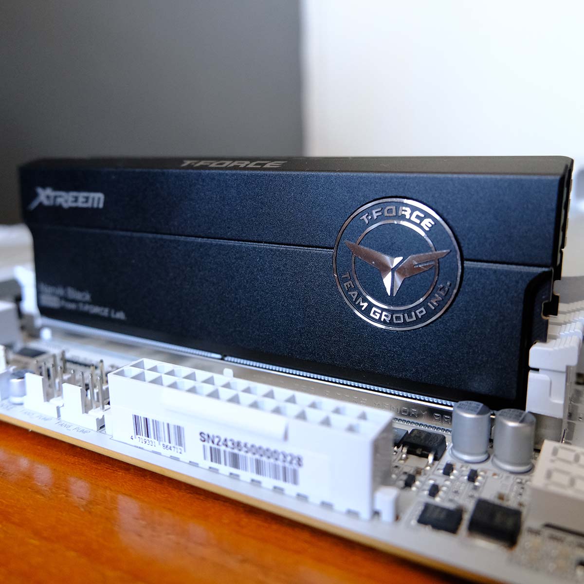 A side-on view of T-Force Xtreem CKD DDR5, placed inside a motherboard.