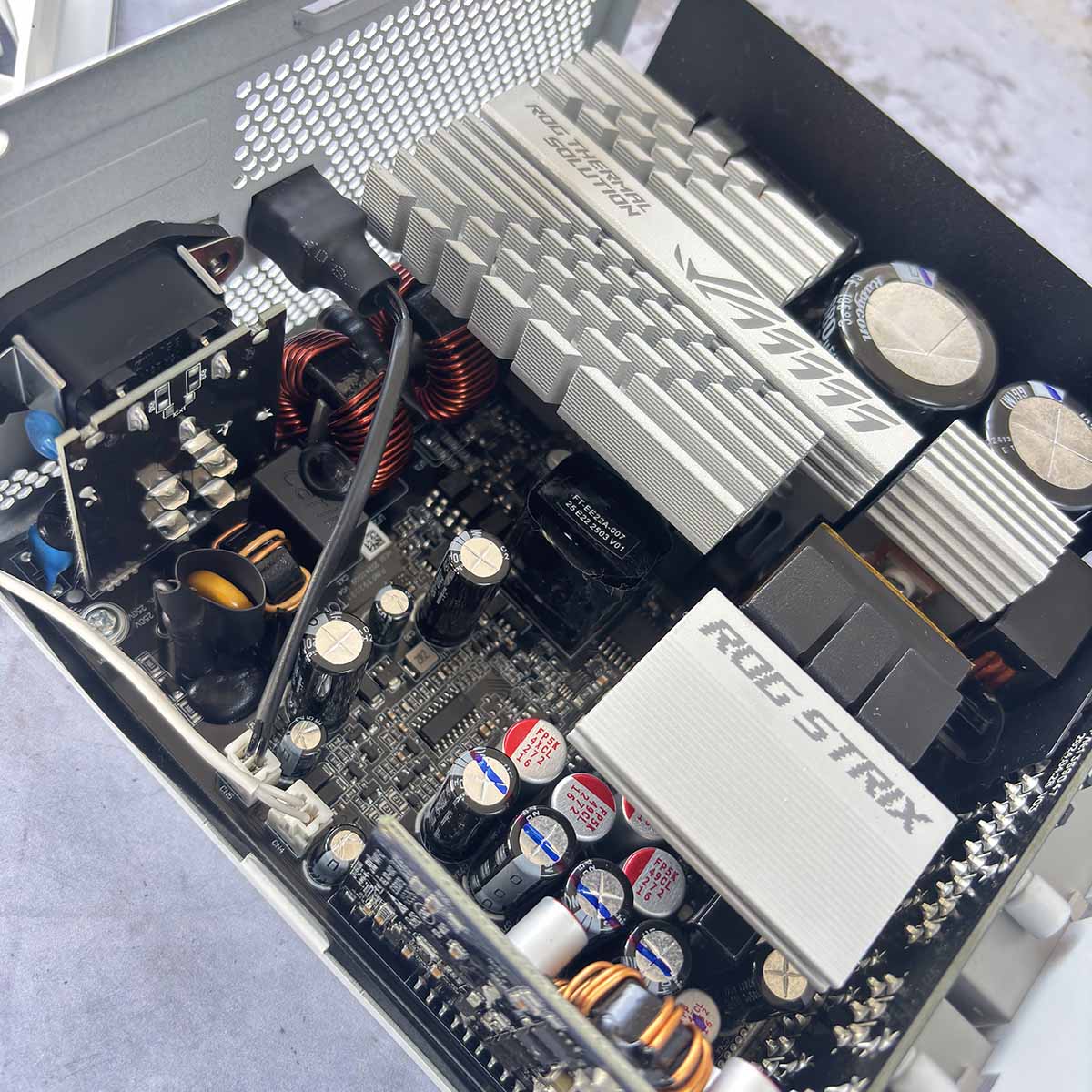 Picture of Asus ROG Strix Platinum 1,000W PSU showing the internals.