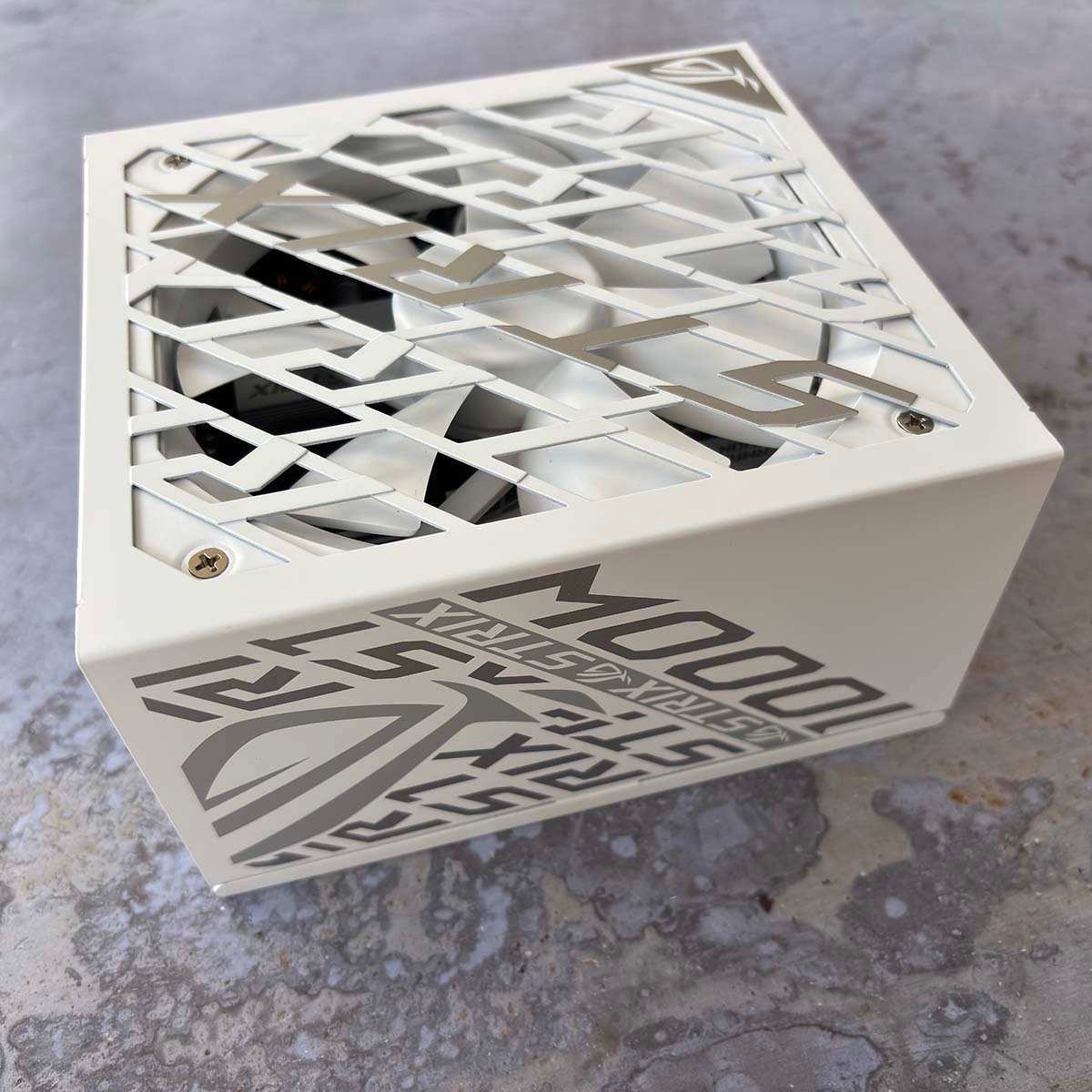 Picture of Asus ROG Strix Platinum 1,00W PSU showing it from one side.