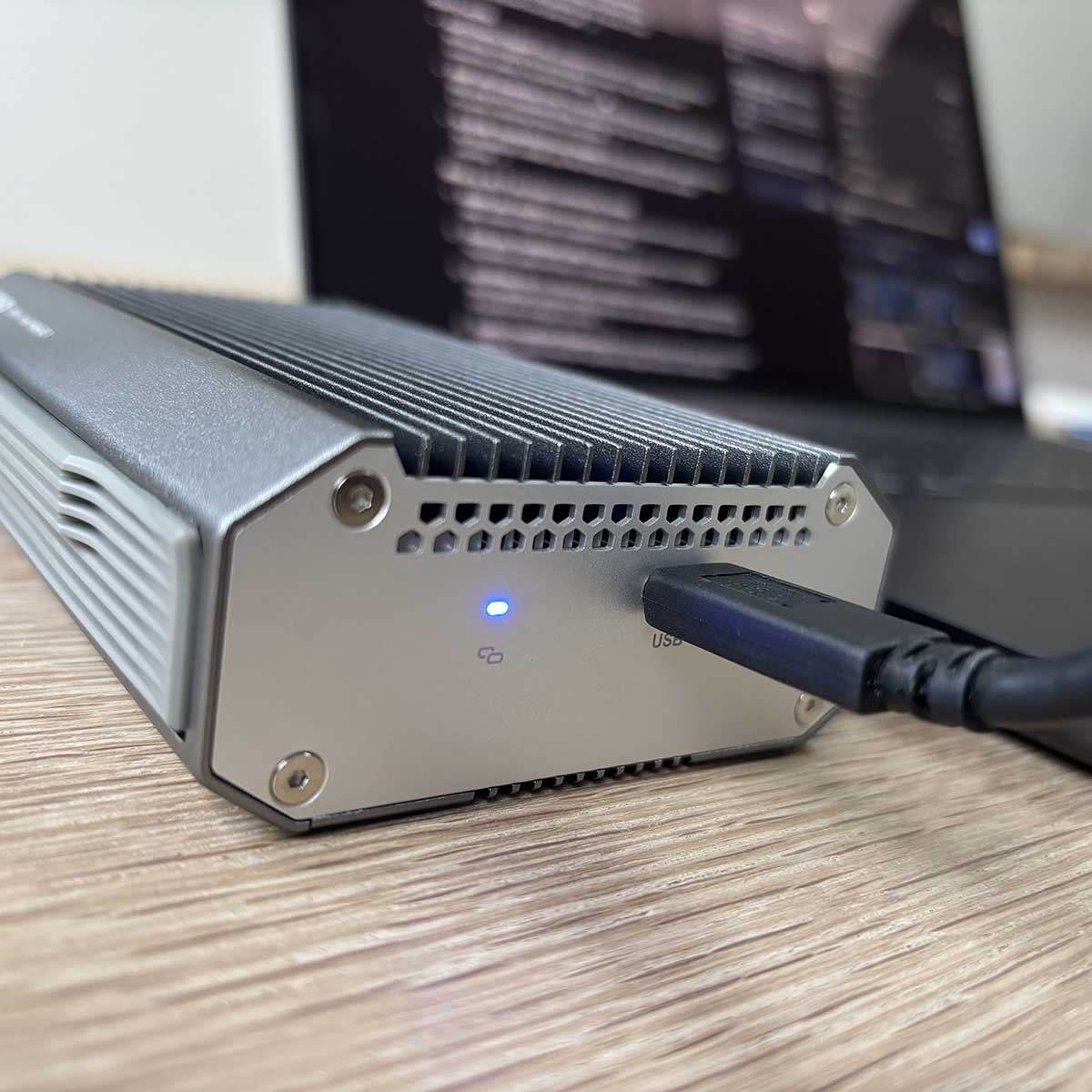 A picture of the QNAP USB to Ethernet adapter from the side.