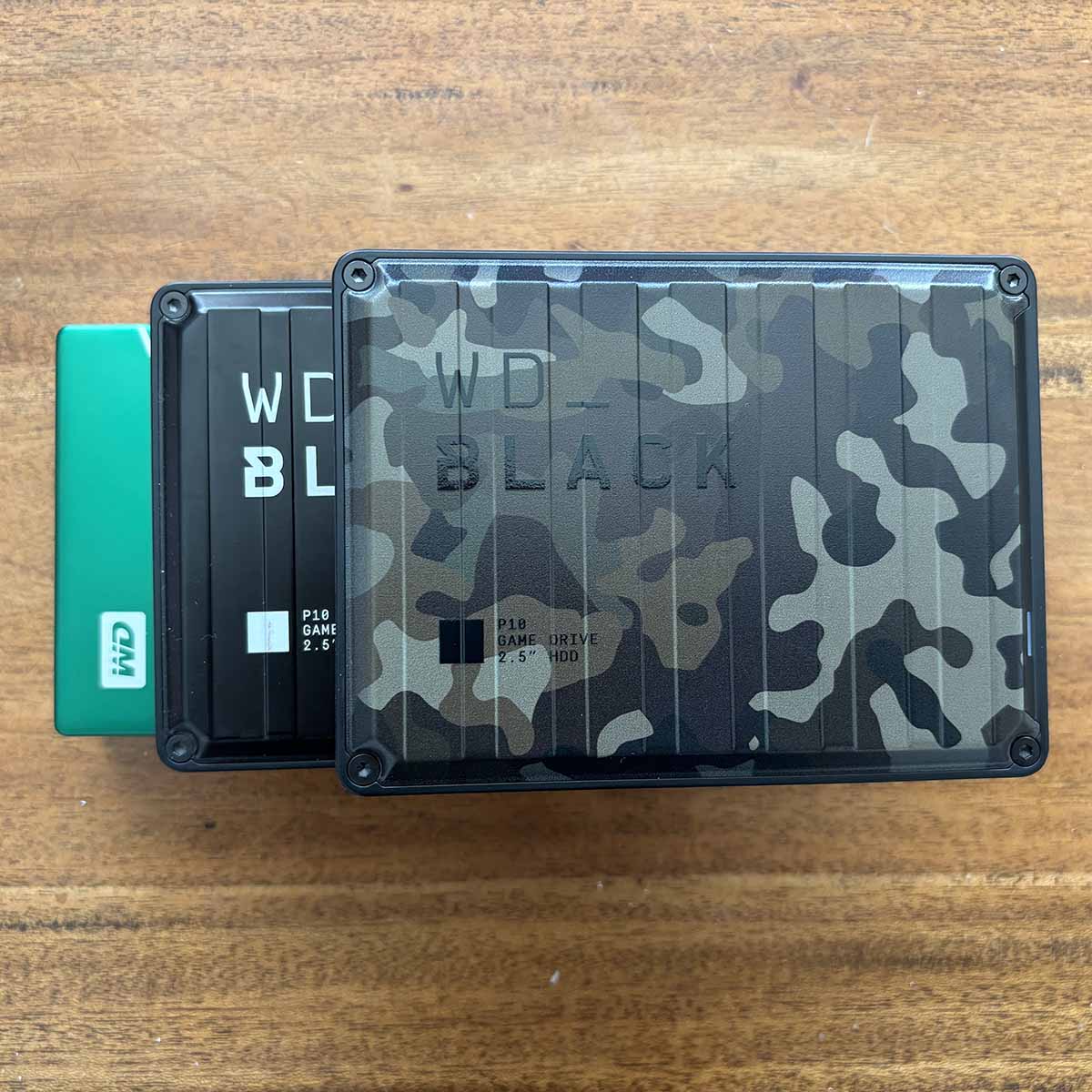 A picture of the WD P10 6TB Camo drive on top of two other WD drives horizontally.