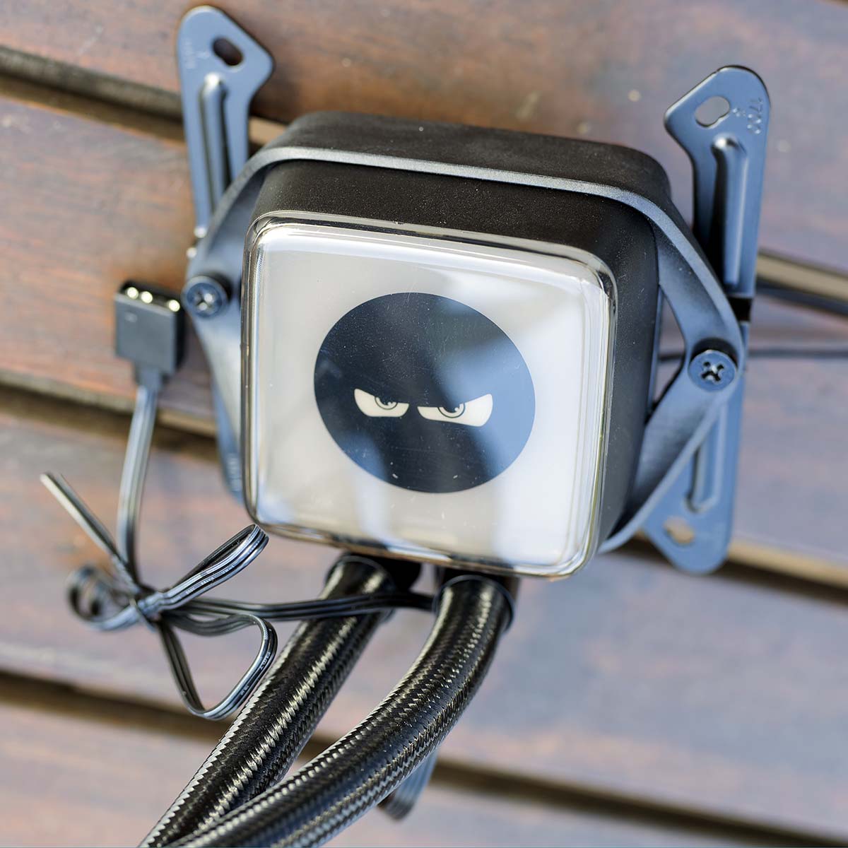 A close-up of be quiet! Pure Loop 3 LX 360's pump with a different stencil applied from stock and bracket attached.