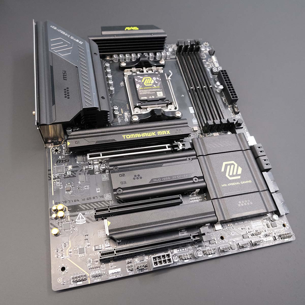 Top-down shot of MAG X870E Tomahawk Max WiFi motherboard.