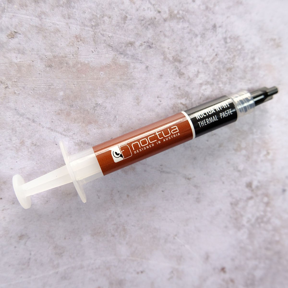 A tube of Noctua NT-H1 Thermal Paste.