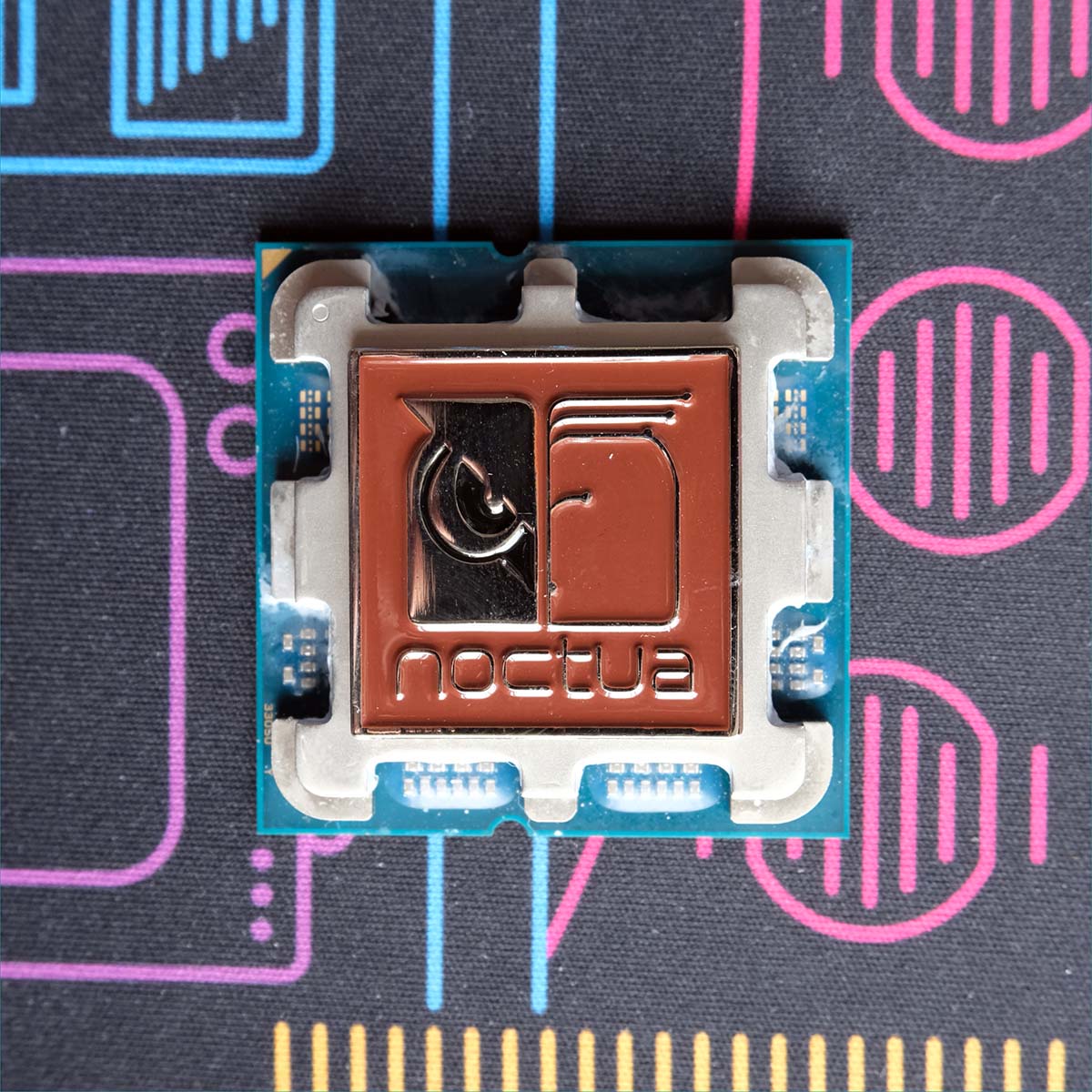 A Noctua badge placed on top of Ryzen 7 9800X3D.