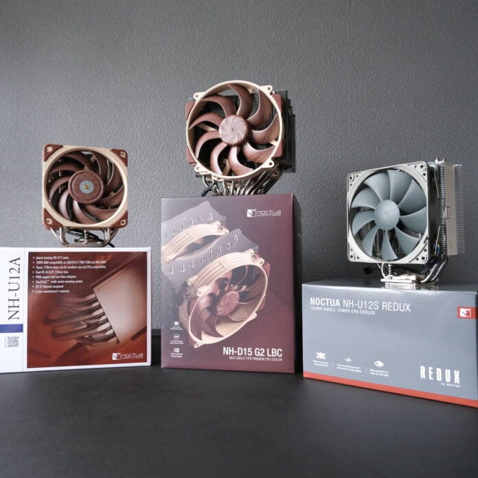 Three Noctua coolers, NH-U12A (left), NH-D15 G2 LBC (centre), and NH-U12S Redux (right) stand on their retail packaging.