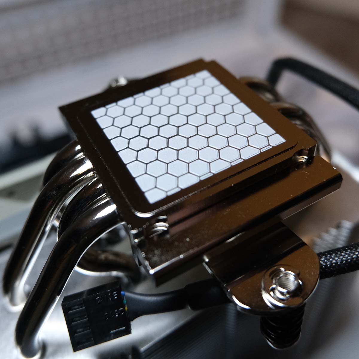 Close-up of pre-applied thermal compound on Noctua NH-12US Redux.