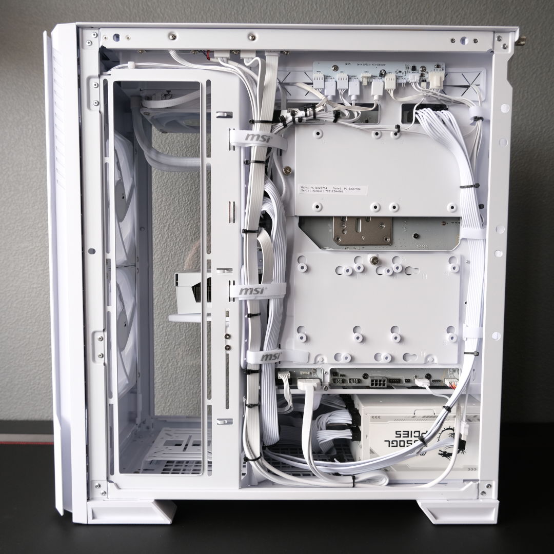 A wide shot of Novatech Reign Sentinel, exposing the cable management behind the system's rear panel.