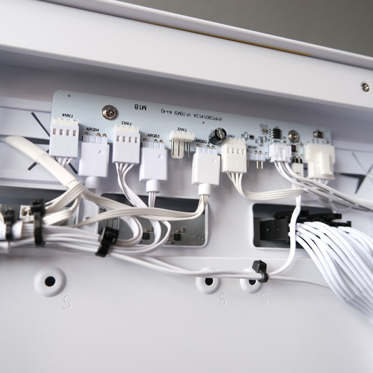 A close up of Novatech Reign Sentinel's fan hub, showcasing the convenience of collating fan and ARGB headers into a central location.
