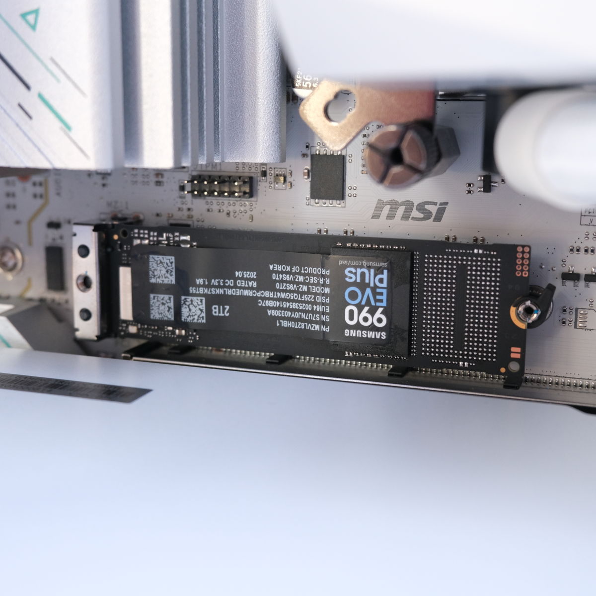 A close up of Samsung 990 Evo, the SSD resting inside an M.2 slot of Novatech Reign Sentinel.