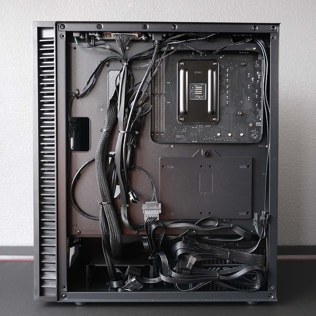A wide-shot of OcUK Gaming Mach 3.1 cable management, rear panel removed.