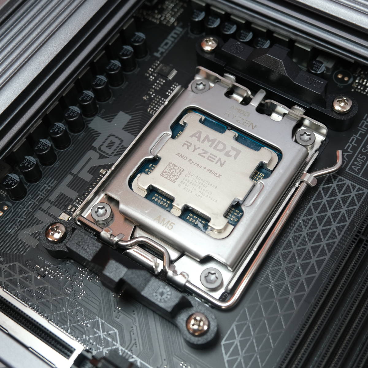 AMD Ryzen 9 9900X inside the AM5 socket on Sapphire Nitro+ B850A WiFi 7 motherboard.
