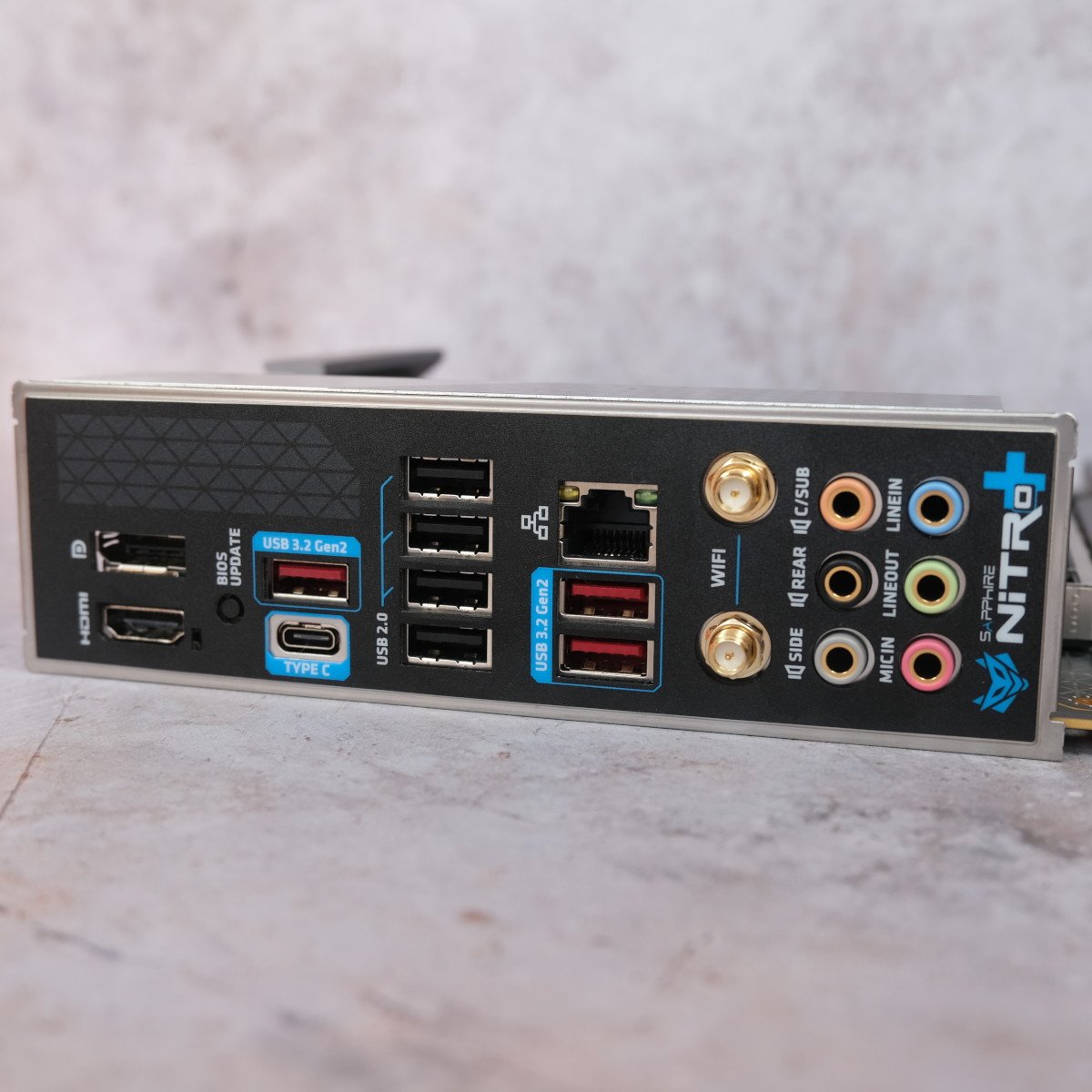 A close up of USB and other ports on the rear of Sapphire Nitro+ B850A WiFi 7.