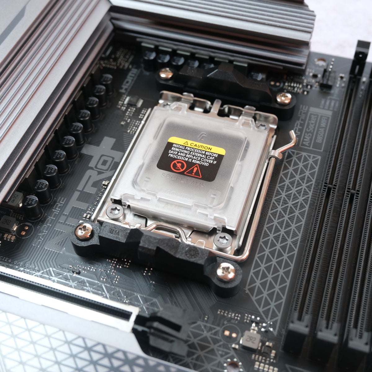 A close up of the ILM cap atop the AM5 socket on Sapphire Nitro+ B850A WiFi 7.