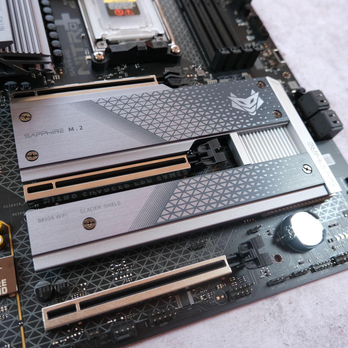 A wide shot of Sapphire Nitro+ B850A WiFi 7's M.2 heatsinks.