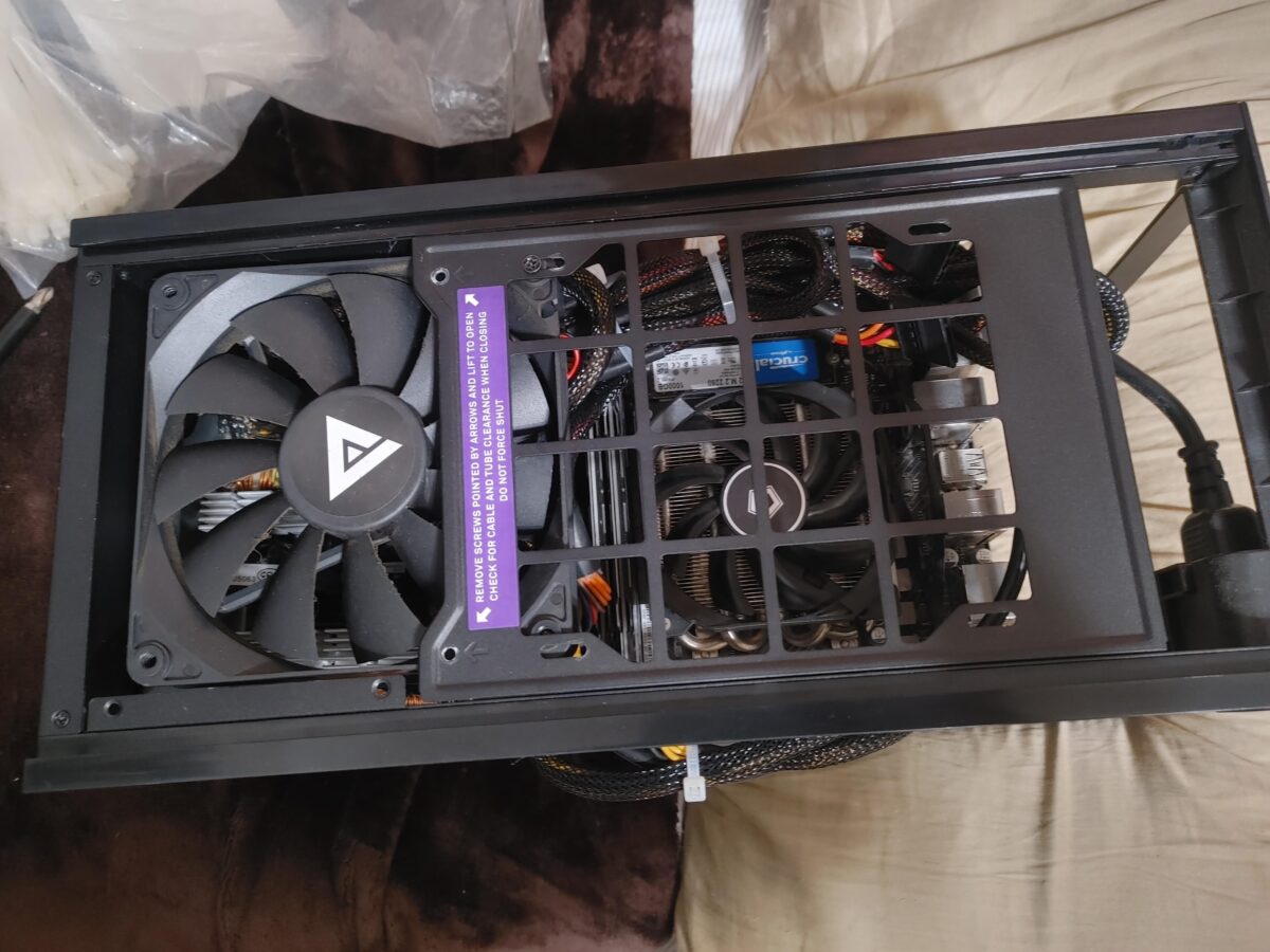 Top-down view of a SFF PC build with odd assortment of components
