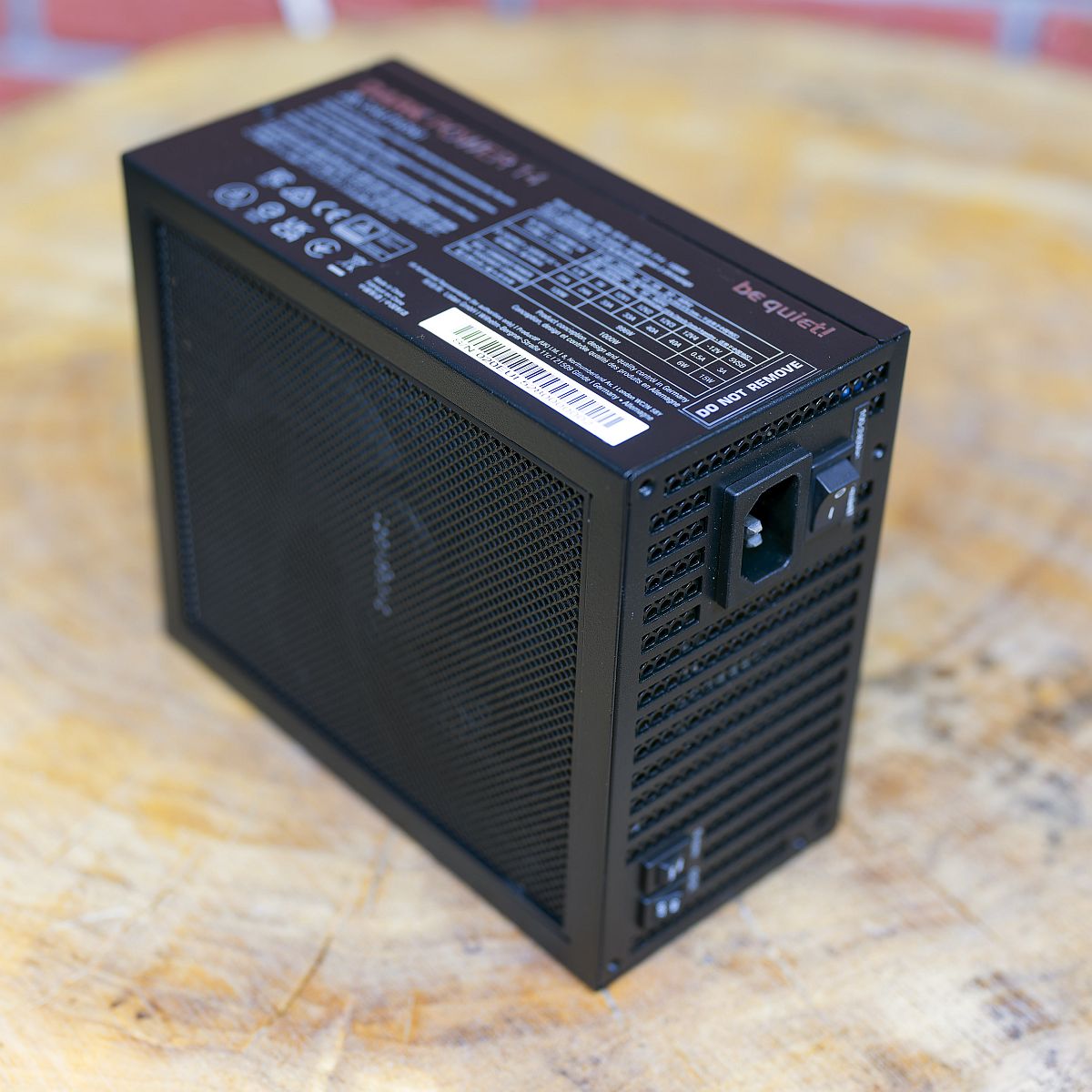 BQ Dark Power 14 1000W external, on a wooden table, PSU, power supply unit