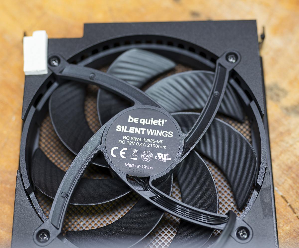 BQ Dark Power 14 1000W fan, Silent Wings 4, 135mm, on a wooden table, PSU, power supply unit