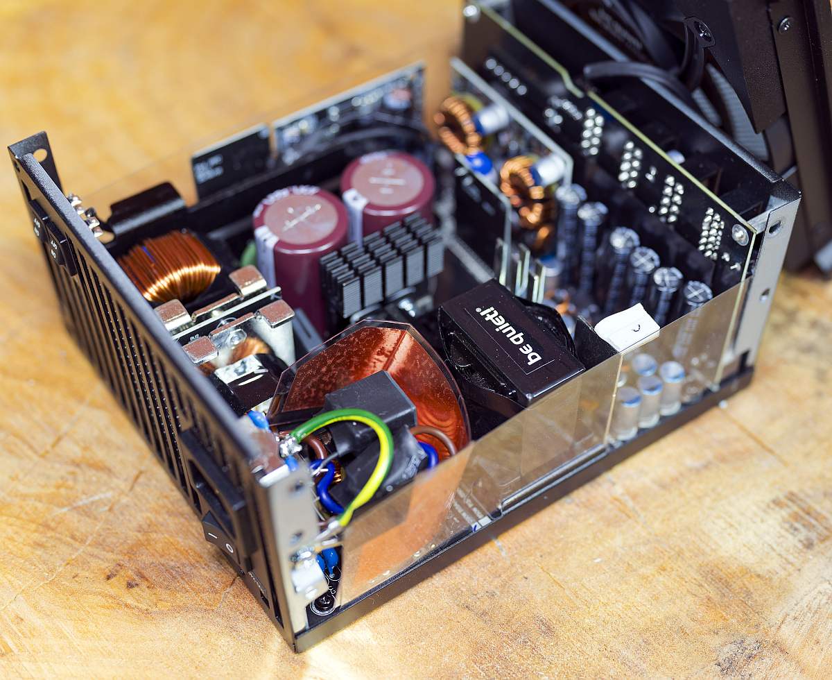 BQ Dark Power 14 1000W internals, on a wooden table, PSU, power supply unit
