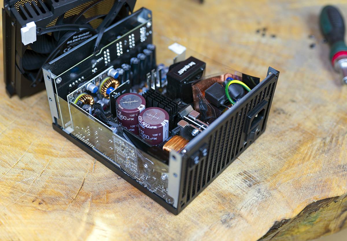 BQ Dark Power 14 1000W internals, on a wooden table, PSU, power supply unit